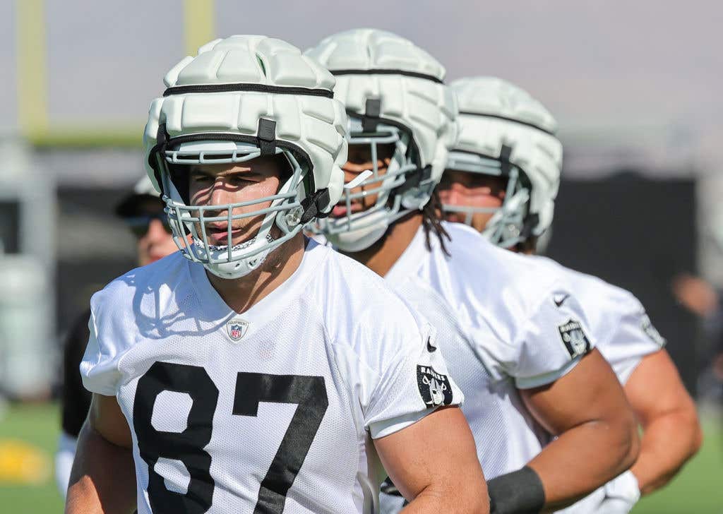 HENDERSON, NEVADA - JULY 27: Tight end Michael Mayer #87 of the Las Vegas Raiders runs on a field during the team's training camp at the Las Vegas Raiders Headquarters/Intermountain Healthcare Performance Center on July 27, 2023 in Henderson, Nevada.