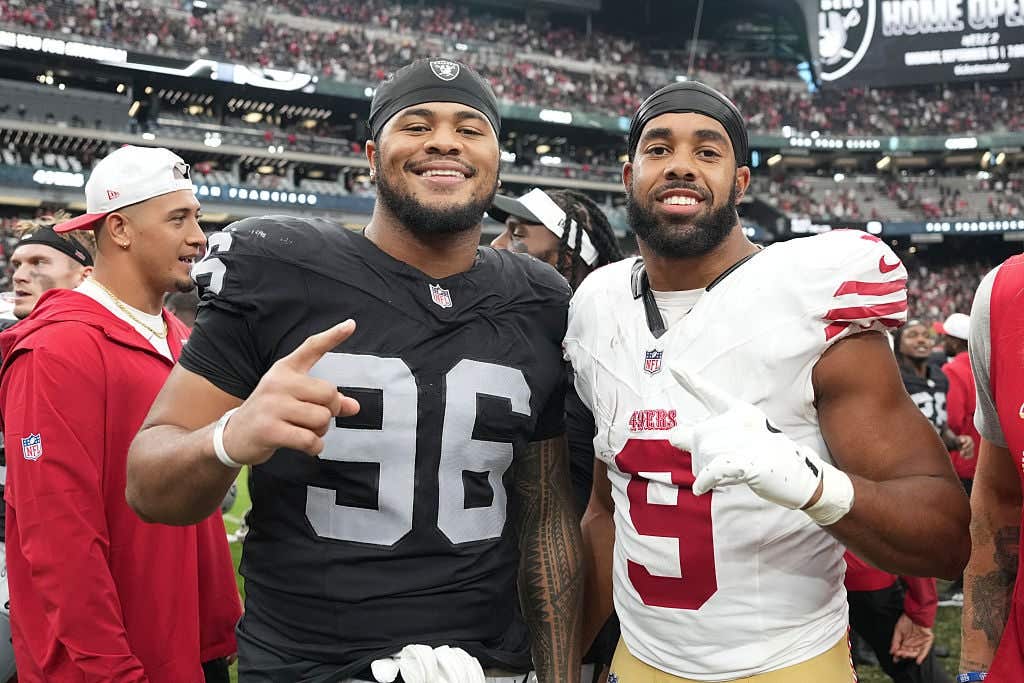 LAS VEGAS, NEVADA - AUGUST 16: Jonah Laulu #96 of the Las Vegas Raiders and Brayden Willis #9 of the San Francisco 49ers pose for photo after the NFL Preseason 2025 game at Allegiant Stadium on August 16, 2025 in Las Vegas, Nevada. The 49ers defeated the Raiders 22-19. (Photo by Candice Ward/Getty Images)